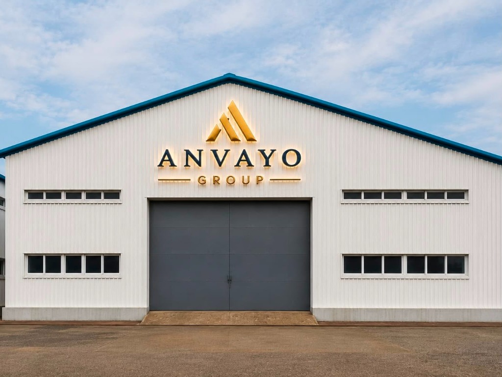 Front facade view of white Anvayo Group dispatch warehouse with golden sign